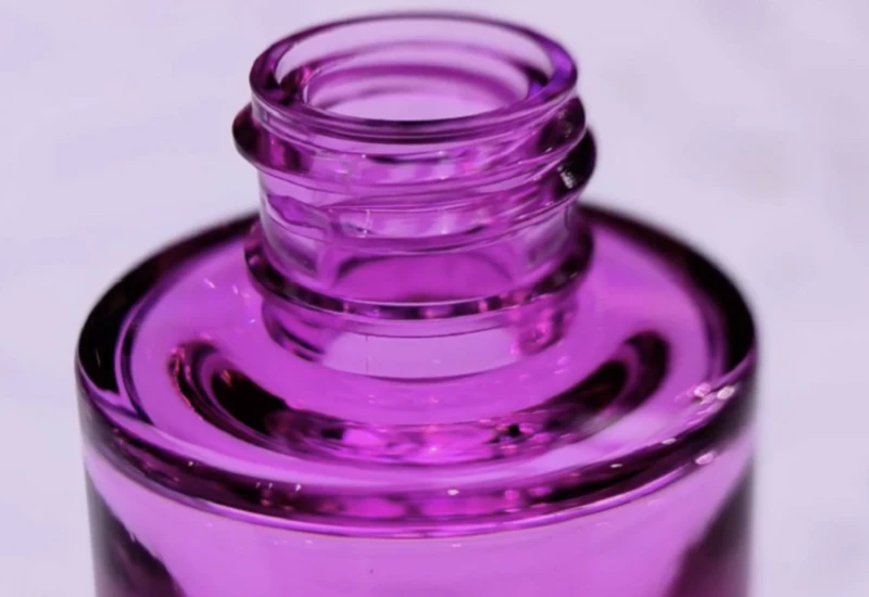 Collection of transparent PET and Tritan product samples made by ISBM moulds